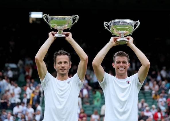 (230716) -- LONDON, July 16, 2023 -- Wesley Koolhof (L) Neal Skupski pose for photos during the awarding ceremony after the men s doubles final match between Wesley Koolhof of the Netherlands Neal Skupski of Britain and Marcel Granollers of Spain Horacio Zeballos of Argentina at Wimbledon tennis Championship in London, Britain, on July 15, 2023. ) (SP)BRITAIN-LONDON-TENNIS-WIMBLEDON-MEN S DOUBLES-FINAL LixYing 