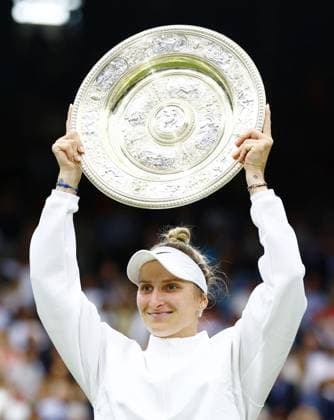 Tennis: Wimbledon championships Marketa Vondrousova of the Czech Republic lifts the victor s trophy after beating Ons Jabeur of Tunisia in the women s singles final at the Wimbledon tennis tournament in London on July 15, 2023.  A14AA0001684841P  