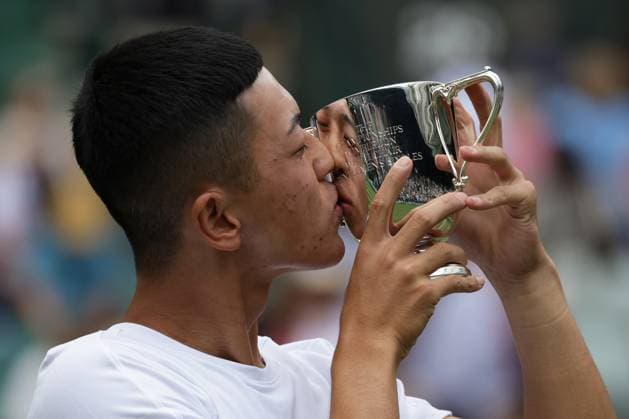 16th July 2023; All England Lawn Tennis and Croquet Club, London, England: Wimbledon Tennis Tournament; Tokito& xa0;Oda (JPN) kisses the trophy after defeating Alfie& xa0;Hewett (GBR) in the men s wheelchair singles final  ActionPlus12531916 JohnxPatrickxFletcher
