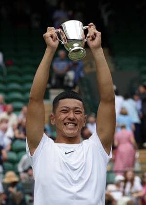 16th July 2023; All England Lawn Tennis and Croquet Club, London, England: Wimbledon Tennis Tournament; Tokito& xa0;Oda (JPN) lifts the trophy after defeating Alfie& xa0;Hewett (GBR) in the men s wheelchair singles final  ActionPlus12531919 JohnxPatrickxFletcher