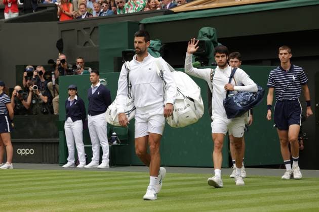 16th July 2023; All England Lawn Tennis and Croquet Club, London, England: Wimbledon Tennis Tournament; Mens singles final on centre court: Novak Djokovic and Carlos Alcaraz take the court for the finals match  ActionPlus12531926 JohnxPatrickxFletcher