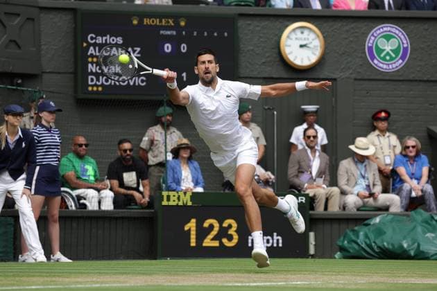 16th July 2023; All England Lawn Tennis and Croquet Club, London, England: Wimbledon Tennis Tournament; Mens singles final on centre court: Novak Djokovic returns to Carlos Alcaraz early in 1st set  ActionPlus12531932 JohnxPatrickxFletcher
