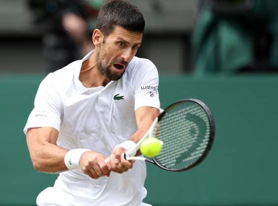 (230716) -- LONDON, July 16, 2023 -- Novak Djokovic hits a return during the men s singles final match between Novak Djokovic of Serbia and Carlos Alcaraz of spain at Wimbledon Tennis Championships in London, Britain, July 16, 2023. ) (SP)BRITAIN-LONDON-TENNIS-WIMBLEDON-DAY 14 HanxYan 