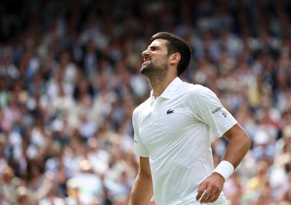 (230716) -- LONDON, July 16, 2023 -- Novak Djokovic reacts during the men s singles final match between Novak Djokovic of Serbia and Carlos Alcaraz of spain at Wimbledon Tennis Championships in London, Britain, July 16, 2023. ) (SP)BRITAIN-LONDON-TENNIS-WIMBLEDON-DAY 14 HanxYan 