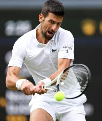 (230716) -- LONDON, July 16, 2023 -- Novak Djokovic hits a return during the men s singles final match between Novak Djokovic of Serbia and Carlos Alcaraz of spain at Wimbledon Tennis Championships in London, Britain, July 16, 2023. ) (SP)BRITAIN-LONDON-TENNIS-WIMBLEDON-DAY 14 HanxYan 
