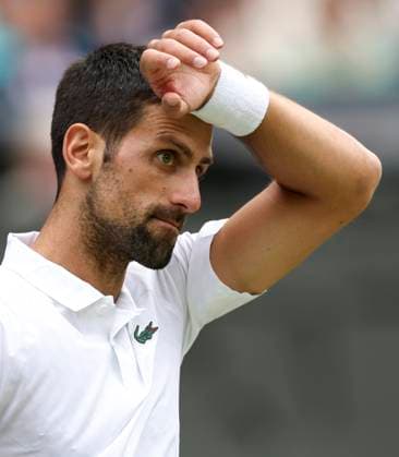 (230716) -- LONDON, July 16, 2023 -- Novak Djokovic reacts during the men s singles final match between Novak Djokovic of Serbia and Carlos Alcaraz of spain at Wimbledon Tennis Championships in London, Britain, July 16, 2023. ) (SP)BRITAIN-LONDON-TENNIS-WIMBLEDON-DAY 14 HanxYan 