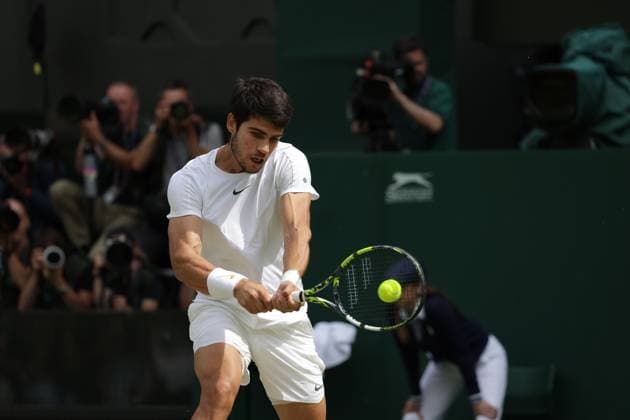 16th July 2023; All England Lawn Tennis and Croquet Club, London, England: Wimbledon Tennis Tournament; Mens singles final on centre court Novak Djokovic versus Carlos Alcaraz; Alcaraz returns  ActionPlus12531985 JohnxPatrickxFletcher