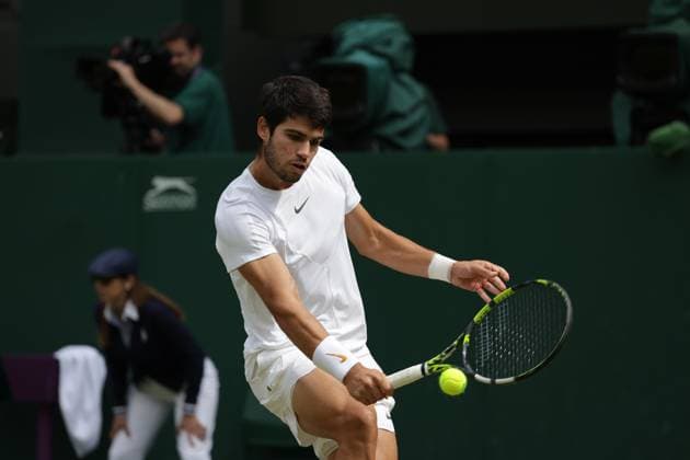 16th July 2023; All England Lawn Tennis and Croquet Club, London, England: Wimbledon Tennis Tournament; Mens singles final on centre court Novak Djokovic versus Carlos Alcaraz; Alcaraz returns  ActionPlus12531993 JohnxPatrickxFletcher