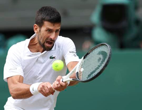 (230716) -- LONDON, July 16, 2023 -- Novak Djokovic hits a return during the men s singles final match between Novak Djokovic of Serbia and Carlos Alcaraz of spain at Wimbledon Tennis Championships in London, Britain, July 16, 2023. ) (SP)BRITAIN-LONDON-TENNIS-WIMBLEDON-DAY 14 HanxYan 