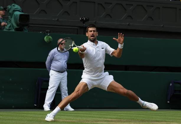16th July 2023; All England Lawn Tennis and Croquet Club, London, England: Wimbledon Tennis Tournament; Mens singles final on centre court Novak Djokovic versus Carlos Alcaraz; Djokovic returns  ActionPlus12532036 JohnxPatrickxFletcher