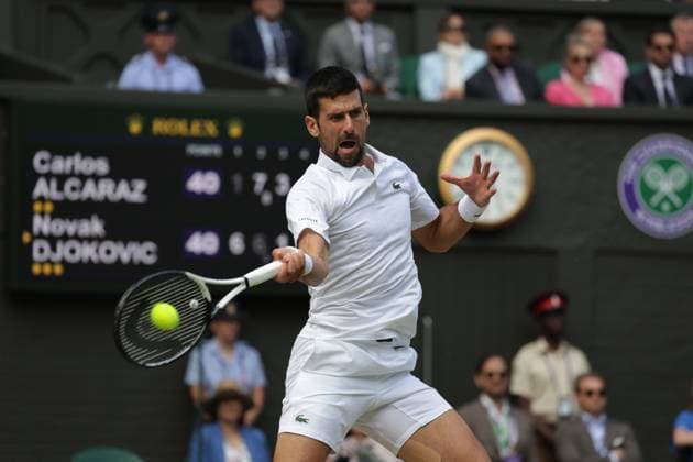 16th July 2023; All England Lawn Tennis and Croquet Club, London, England: Wimbledon Tennis Tournament; Mens singles final on centre court Novak Djokovic versus Carlos Alcaraz; Djokovic returns  ActionPlus12532061 JohnxPatrickxFletcher