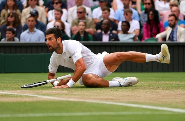 Mandatory Credit: Photo by Ella Ling Shutterstock (14011309gi) Novak Djokovic falls during the Men s Singles final Wimbledon Tennis Championships, Day 14, The All England Lawn Tennis and Croquet Club, London, UK - 16 Jul 2023 Wimbledon Tennis Championships, Day 14, The All England Lawn Tennis and Croquet Club, London, UK - 16 Jul 2023  Copyright: xEllaxLing Shutterstockx 14011309gi