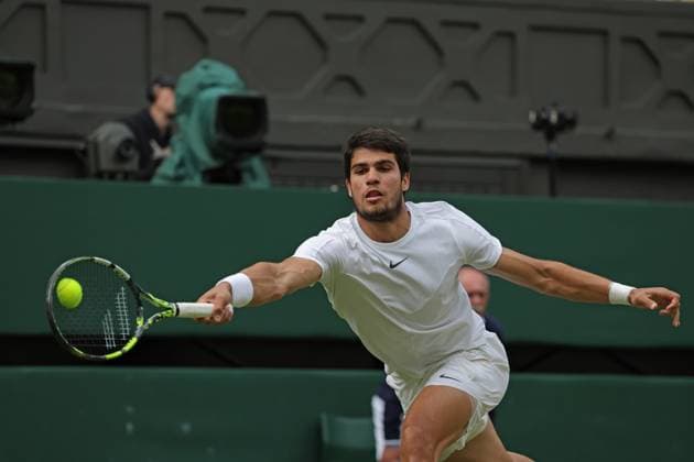 16th July 2023; All England Lawn Tennis and Croquet Club, London, England: Wimbledon Tennis Tournament; Mens singles final on centre court Novak Djokovic versus Carlos Alcaraz; Alcaraz returns  ActionPlus12532085 JohnxPatrickxFletcher