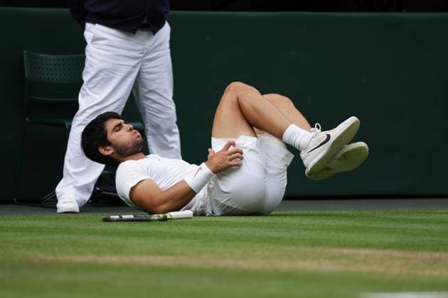 16th July 2023; All England Lawn Tennis and Croquet Club, London, England: Wimbledon Tennis Tournament; Mens singles final on centre court Novak Djokovic versus Carlos Alcaraz; Alcaraz slips awkwardly on court  ActionPlus12532091 JohnxPatrickxFletcher