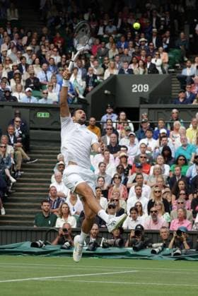 16th July 2023; All England Lawn Tennis and Croquet Club, London, England: Wimbledon Tennis Tournament; Mens singles final on centre court Novak Djokovic versus Carlos Alcaraz; Djokovic with an overhead smash  ActionPlus12532093 JohnxPatrickxFletcher