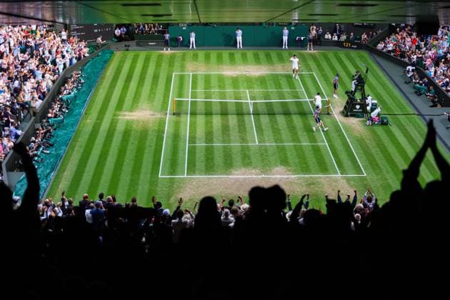 Mandatory Credit: Photo by Kieran McManus Shutterstock (14011306cy) Novak Djokovic smashes his racket into the net post as the crowd celebrate the Carlos Alcaraz break Wimbledon Tennis Championships, Day 14, The All England Lawn Tennis and Croquet Club, London, UK - 16 Jul 2023 Wimbledon Tennis Championships, Day 14, The All England Lawn Tennis and Croquet Club, London, UK - 16 Jul 2023  Copyright: xKieranxMcManus Shutterstockx 14011306cy
