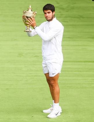 Mandatory Credit: Photo by Kieran McManus Shutterstock (14011306dn) Carlos Alcaraz wins the Mens Singles Championship at Wimbledon Beating Novak Djokovic and lifts the trophy as Catherine, Princess of Wales looks on Wimbledon Tennis Championships, Day 14, The All England Lawn Tennis and Croquet Club, London, UK - 16 Jul 2023 Wimbledon Tennis Championships, Day 14, The All England Lawn Tennis and Croquet Club, London, UK - 16 Jul 2023  Copyright: xKieranxMcManus Shutterstockx 14011306dn