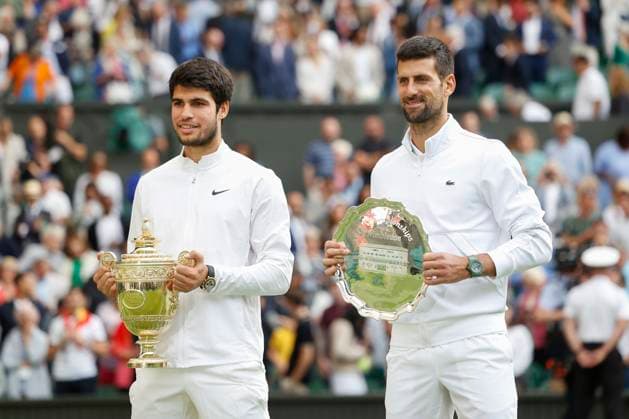 Finalist Novak Djokovic and winner Carlos Alcaraz with the cup, trophy, award ceremony, presentation Copyright: xJuergenxHasenkopfx