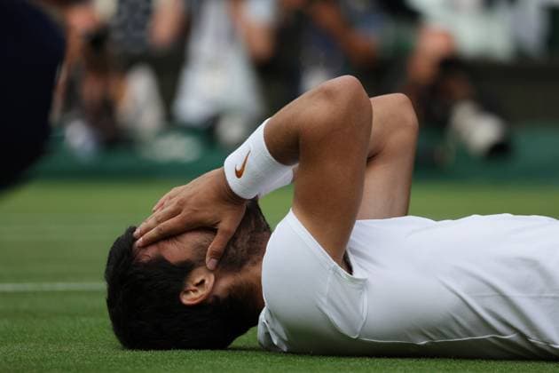 16th July 2023; All England Lawn Tennis and Croquet Club, London, England: Wimbledon Tennis Tournament; Mens singles final on centre court Novak Djokovic versus Carlos Alcaraz; Alcaraz falls to the grass to celebrate his 5 set win  ActionPlus12532132 JohnxPatrickxFletcher