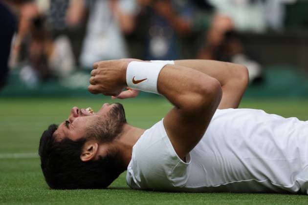 16th July 2023; All England Lawn Tennis and Croquet Club, London, England: Wimbledon Tennis Tournament; Mens singles final on centre court Novak Djokovic versus Carlos Alcaraz; Alcaraz falls to the grass to celebrate his 5 set win  ActionPlus12532133 JohnxPatrickxFletcher