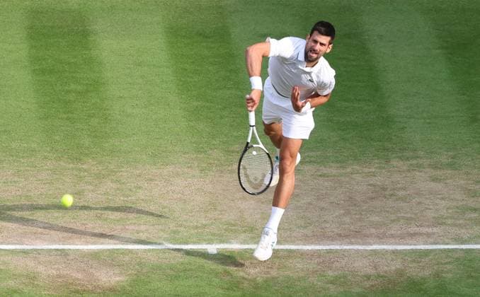 Serbian Novak Djokovic smashes the ball in the Wimbledon Men s Final match against Spain s Carlos Alcaraz at the 2023 Wimbledon championships in London on Sunday, July 16, 2023. Alcaraz won the match 1-6,7-6,6-1,3-6,6-4.  LON2023071616 HUGOxPHILPOTT