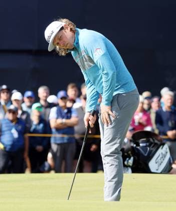 Last year s Open winner Australian Cameron Smith lines up a putt on the second green on the first day at the 151st Open Championship at the Royal Liverpool Golf Club in Hoylake England on Thursday, July 20, 2023.  LON2023072015a HUGOxPHILPOTT