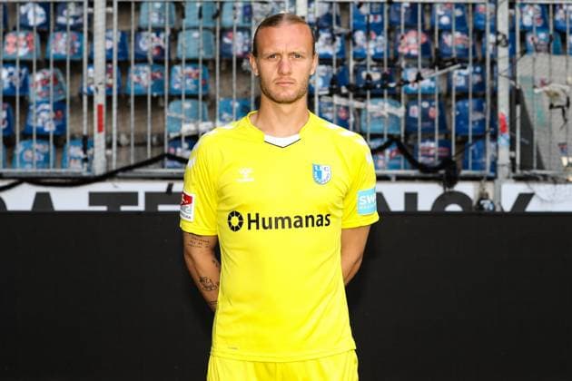 Goalkeeper Dominik Reimann 1 FC Magdeburg,1 2 Football Bundesliga portrait appointment 2023 2024 official photo appointment 1 FC Magdeburg in the MDCC Arena in Magdeburg portrait, portrait,single image,Germany, football, men,GER,20 07 2023 Christian Schroedter