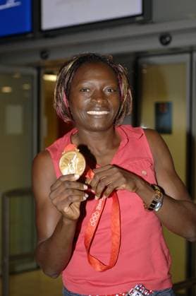 Beijing 2008 Olympics - Francoise Etone Mbango backs in Paris Cameroon s Francoise Etone Mbango arrives at the Roissy airtport in Paris, France on August 21, 2008. Francoise Etone Mbango won the Women s Triple Jump Gold Medal. Photo by Giancarlo Gorassini Cameleon ABACAPRESS.COM Paris France  Copyright: xGorassinixGiancarlo ABACAx 161536_01 GorassinixGiancarlo ABACAx 161536_01