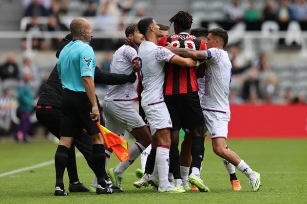 NEWCASTLE UPON TYNE, ENGLAND AUGUST 06: Ewann Guessand (C) is restrained by ACF Fiorentina players during the Sela Cup soccer match between ACF Fiorentina and OGC Nice at St. James Park on August 06, 2023 in Newcastle upon Tyne, England. Sela Cup soccer tournament SELA_2023