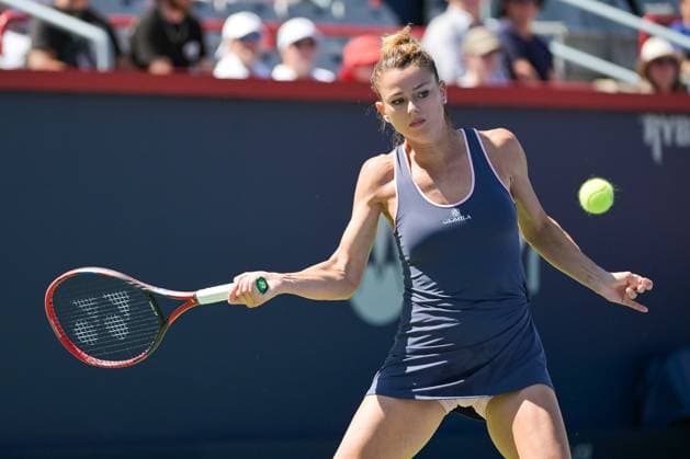 MONTREAL, QC - AUGUST 06: Camila Giorgi (ITA) returns the ball during a qualifying round match at WTA, Tennis Damen National Bank Open on August 06, 2023 at IGA Stadium in Montreal, QC (Photo by David Kirouac Icon Sportswire) TENNIS: AUG 06 National Bank Open EDITORIAL USE ONLY Icon230806015