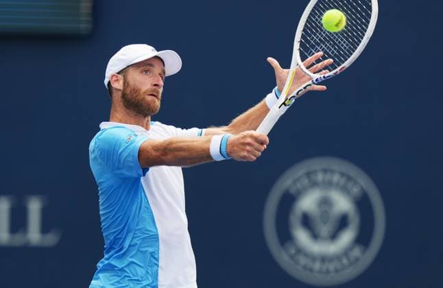 (230807) -- TORONTO, Aug. 7, 2023 -- Constant Lestienne of France returns the ball against Thanasi Kokkinakis of Australia during the second round of men s qualifying singles match at the 2023 National Bank Open in Toronto, Canada, on Aug. 6, 2023. (Photo by Xinhua) (SP)CANADA-TORONTO-TENNIS-NATIONAL BANK OPEN-MEN S SINGLES-QUALIFICATIONS ZouxZheng 