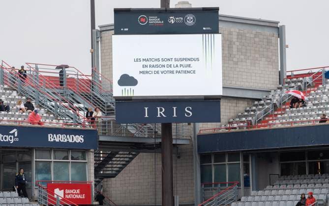 August 7, 2023, Montreal, PQ, Canada: A sign translating to play suspended due to rain is shown at the National Bank Open tennis tournament in Montreal on Monday, August 7, 2023. Canada News - August 7, 2023  - ZUMAc35_ 20230807_zaf_c35_018 Copyright: xGrahamxHughesx