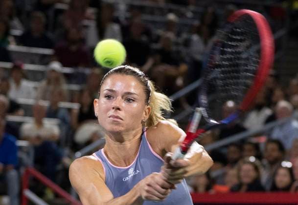 August 8, 2023, MONTREAL, PQ, Canada: Camila Giorgi of Italy, hits a return to Bianca Andreescu of Canada, during the National Bank Open tennis tournament in Montreal, Tuesday, August 8, 2023. Canada News - August 8, 2023  - ZUMAc35_ 20230808_zaf_c35_089 Copyright: xChristinnexMuschix