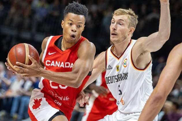 Basketball Laender games, Germany Canada, Mercedes Benz Arena Phil Scrubb from Canada fights Germanys Niels Giffey r for the ball Basketball Laender game Germany Canada