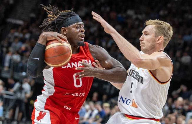 Basketball Laender games, Germany Canada, Mercedes Benz Arena Luguentz Dort from Canada fights against Germanys Niels Giffey r for the ball Basketball Laender game Germany Canada