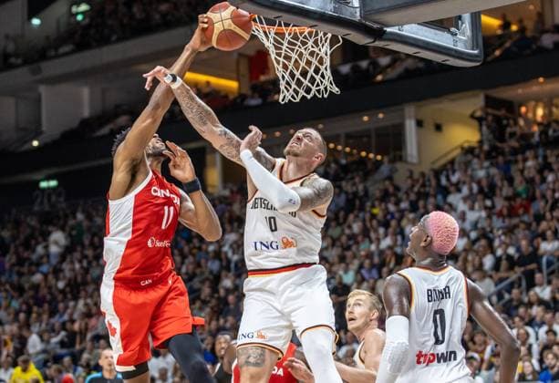 Basketball Laender games, Germany Canada, Mercedes Benz Arena Kyle Alexander l from Canada jumps to the basket against Germanys Daniel Theis M Basketball Laender games Germany Canada