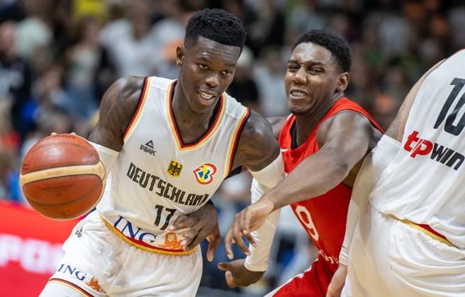 Basketball Laender games, Germany Canada, Mercedes Benz Arena Germanys Dennis Schroeder l fights R J Barrett from Canada for the ball Basketball Laender game Germany Canada