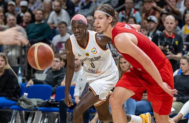 Basketball Laender games, Germany Canada, Mercedes Benz Arena Germanys Isaac Bonga l fights Kelly Olynyk from Canada for the ball Basketball Laender game Germany Canada