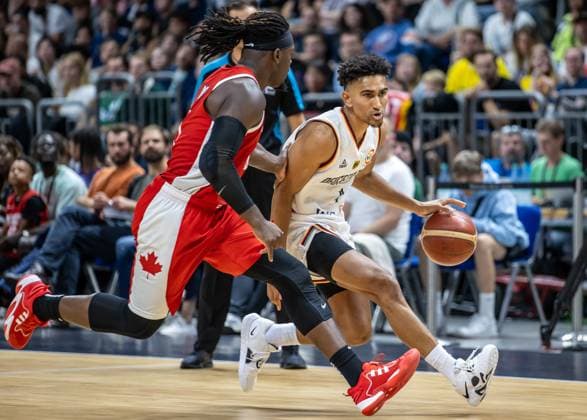 Basketball Laender games, Germany Canada, Mercedes Benz Arena Germanys Maodo Lo r fights Luguentz Dort from Canada for the ball Basketball Laender game Germany Canada