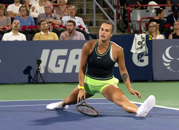 August 9, 2023, MONTREAL, PQ, Canada: Aryna Sabalenka of Belarus does the splits on court during her game against Petra Martic of Croatia during the National Bank Open tennis tournament in Montreal, Wednesday, Aug. 9, 2023. Canada News - August 9, 2023  - ZUMAc35_ 20230809_zaf_c35_168 Copyright: xChristinnexMuschix