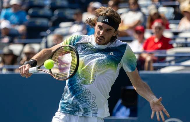 (230810) -- TORONTO, Aug. 10, 2023 -- Stefanos Tsitsipas competes during the men s singles round of 32 match between Stefanos Tsitsipas of Greece and Gael Monfils of France at the National Bank Open tennis tournament in Toronto, Canada, on Aug. 9, 2023. ) (SP)CANADA-TORONTO-TENNIS-NATIONAL BANK OPEN-MEN S SINGLES ZouxZheng 
