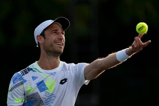 TORONTO, ON - AUGUST 10: Sander Gille of Belgium serves during his doubles match of the National Bank Open, part of the Hologic ATP, Tennis Herren Tour, at Sobeys Stadium on August 10, 2023 in Toronto, Canada. (Photo by Julian Avram Icon Sportswire) TENNIS: AUG 10 National Bank Open EDITORIAL USE ONLY Icon2308101415