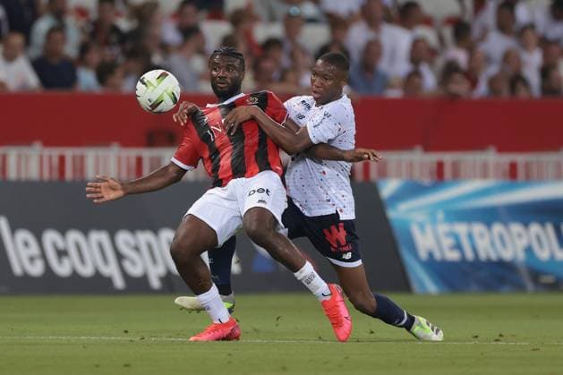 Nice, France, 11th August 2023. Bafode Diakite of LOSC LILLE tussles with Terem Moffi of OGC Nice during the Ligue 1 match at Allianz Riviera Stadium, Nice. Picture credit should read: Jonathan Moscrop Sportimage EDITORIAL USE ONLY. No use with unauthorised audio, video, data, fixture lists, club league logos or live services. Online in-match use limited to 120 images, no video emulation. No use in betting, games or single club league player publications. SPI-2504-0002