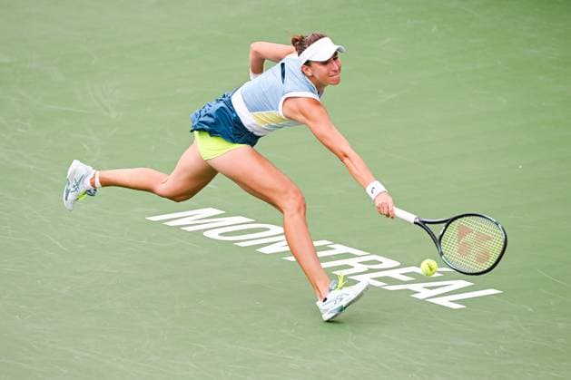 MONTREAL, QC - AUGUST 11: Belinda Bencic (SUI) returns the ball during a third round match at WTA, Tennis Damen National Bank Open on August 11, 2023 at IGA Stadium in Montreal, QC (Photo by David Kirouac Icon Sportswire) TENNIS: AUG 11 National Bank Open EDITORIAL USE ONLY Icon230811018