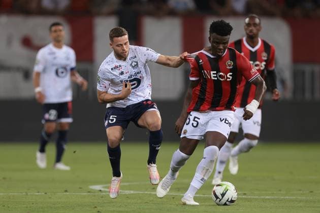 Nice, France, 11th August 2023. Gabriel Gudmundsson of LOSC Lille tussles with Youssuf Ndayishimiye of OGC Nice during the Ligue 1 match at Allianz Riviera Stadium, Nice. Picture credit should read: Jonathan Moscrop Sportimage EDITORIAL USE ONLY. No use with unauthorised audio, video, data, fixture lists, club league logos or live services. Online in-match use limited to 120 images, no video emulation. No use in betting, games or single club league player publications. SPI-2504-0028