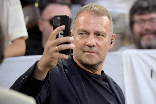 12 08 2023, xemx, football supercup 2023, FC Bayern Muenchen RB Leipzig emspor, v l coach Hans Dieter Hansi Flick German national football team DFB with cell phone DFL DFB REGULATES PROHIBIT ANY USE OF PHOTOGRAPHS as IMAGE SEQUENCES and or QUASI VIDEO Muenchen