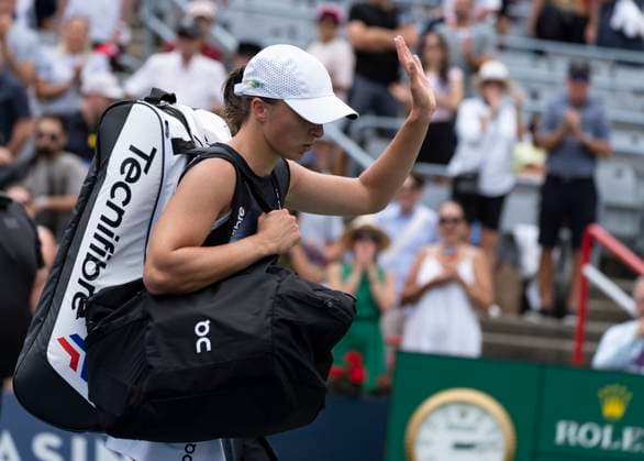 August 12, 2023, MONTREAL, PQ, Canada: Iga Swiatek of Poland, waves as she exits the court following her loss to Jessica Pegula of the United States, during semifinal action at the National Bank Open tennis tournament in Montreal, Saturday, Aug. 12, 2023. Canada News - August 12, 2023  - ZUMAc35_ 20230812_zaf_c35_027 Copyright: xChristinnexMuschix