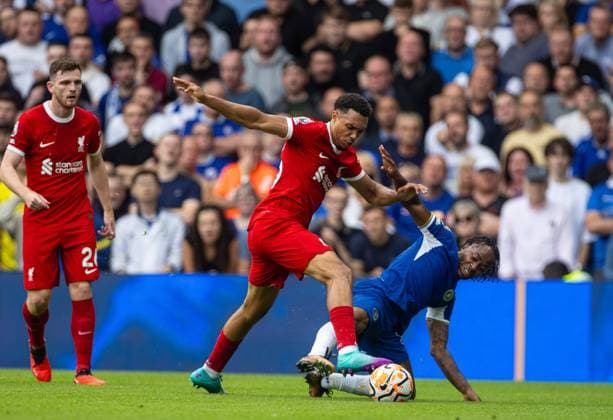 (230814) -- LONDON, Aug. 14, 2023 -- Liverpool s Trent Alexander-Arnold (L) is challenged by Chelsea s Raheem Sterling during the English Premier League match between Chelsea and Liverpool in London, Britain, on Aug. 13, 2023. FOR EDITORIAL USE ONLY. NOT FOR SALE FOR MARKETING OR ADVERTISING CAMPAIGNS. NO USE WITH UNAUTHORIZED AUDIO, VIDEO, DATA, FIXTURE LISTS, CLUB LEAGUE LOGOS OR LIVE SERVICES. ONLINE IN-MATCH USE LIMITED TO 45 IMAGES, NO VIDEO EMULATION. NO USE IN BETTING, GAMES OR SINGLE CLUB LEAGUE PLAYER PUBLICATIONS. (SP)BRITAIN-LONDON-FOOTBALL-ENGLISH PREMIER LEAGUE-CHELSEA VS LIVERPOOL LixYing
