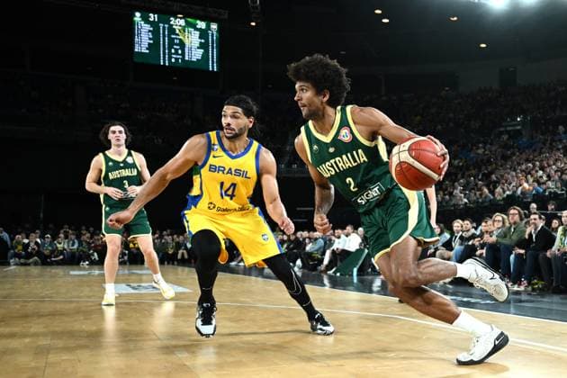 Sport Themen der Woche KW33 BASKETBALL AUSTRALIA BRAZIL, Matisse Thybulle of Australia (right) under pressure from Leonardo Meindl of Brazil (centre) during the Boomers vs World basketball match between the Australian Boomers and Brazil at Rod Laver Arena in Melbourne, Wednesday, August 16, 2023. ( NO ARCHIVING, EDITORIAL USE ONLY, NO USE IN BOOKS WITHOUT CONSENT MELBOURNE VICTORIA AUSTRALIA  Copyright: xJOELxCARRETTx 20230816001831465591