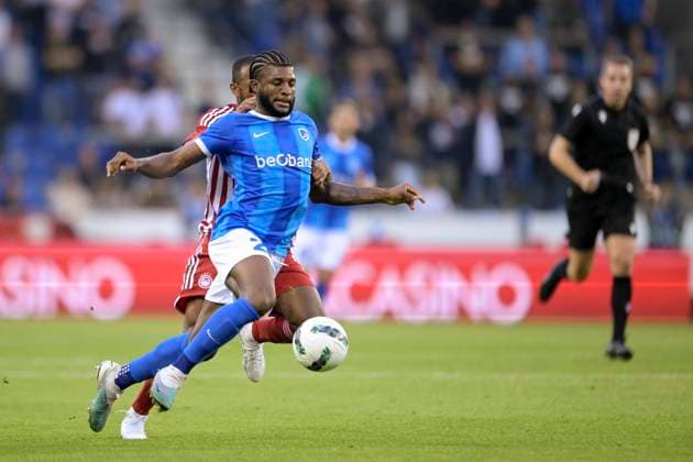 KRC Genk v Olympiacos - UEFA Europa League Qualifying GENK, BELGIUM - AUGUST 17 : McKenzie Mark defender of KRC Genk battles for the ball with Ayoub El Kaabi forward of Olympiacos FC during the second leg match of the UEFA Europa League season 2023 - 2024 third qualifying round between KRC Genk and Olympiacos on August 17, 2023 in Genk, BELGIUM, 17 08 2023 Genk BELGIUM  Copyright: xSesx